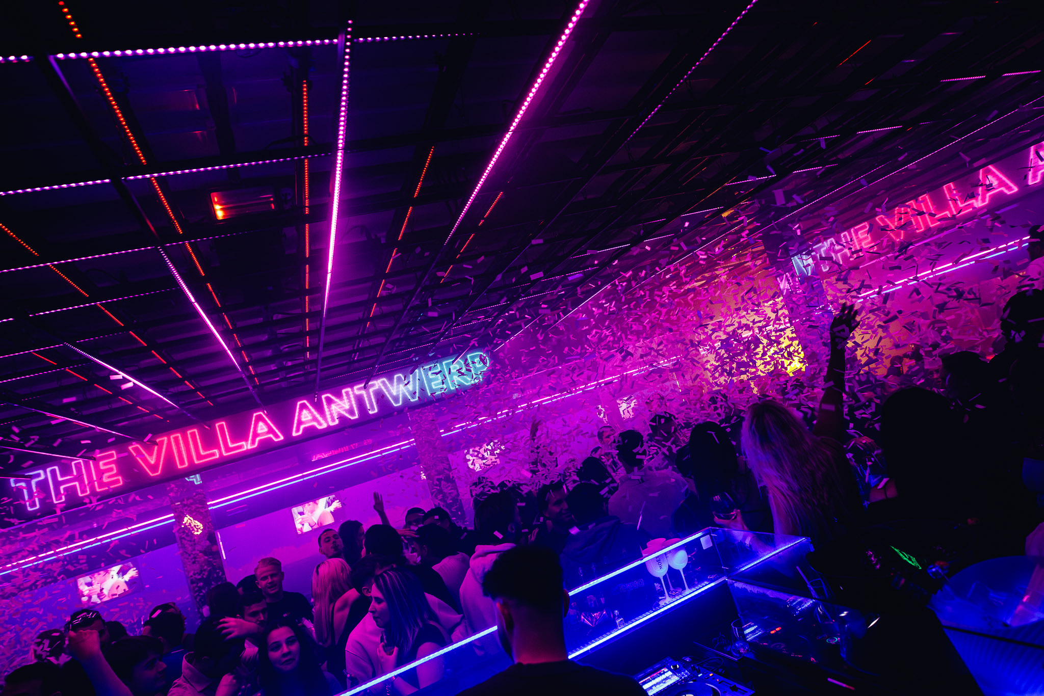 The Villa Antwerp neon and confetti on the dancefloor